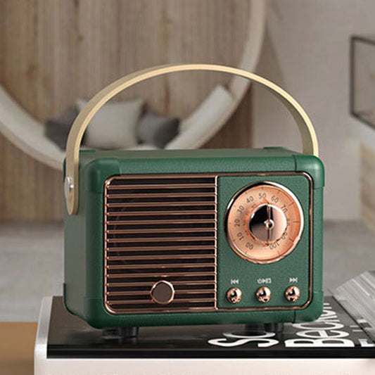 Vintage-style green radio on a book with a blurred indoor background